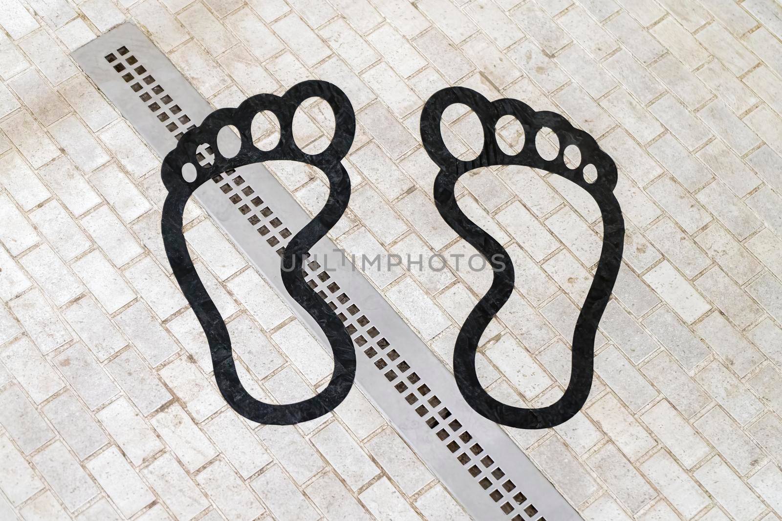 footprints on the tile in the shower. High quality photo