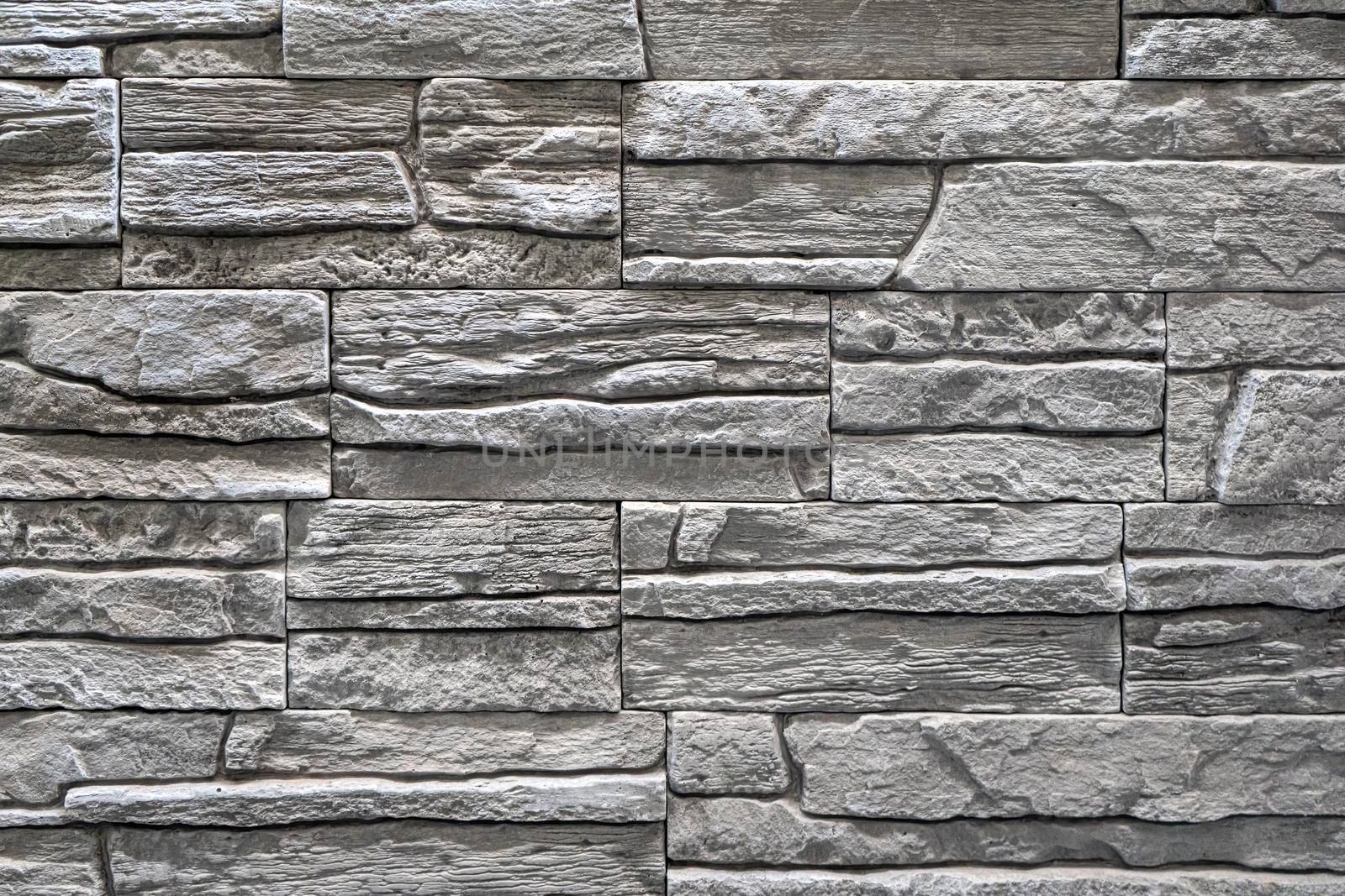 masonry wall paving stones as a background close up