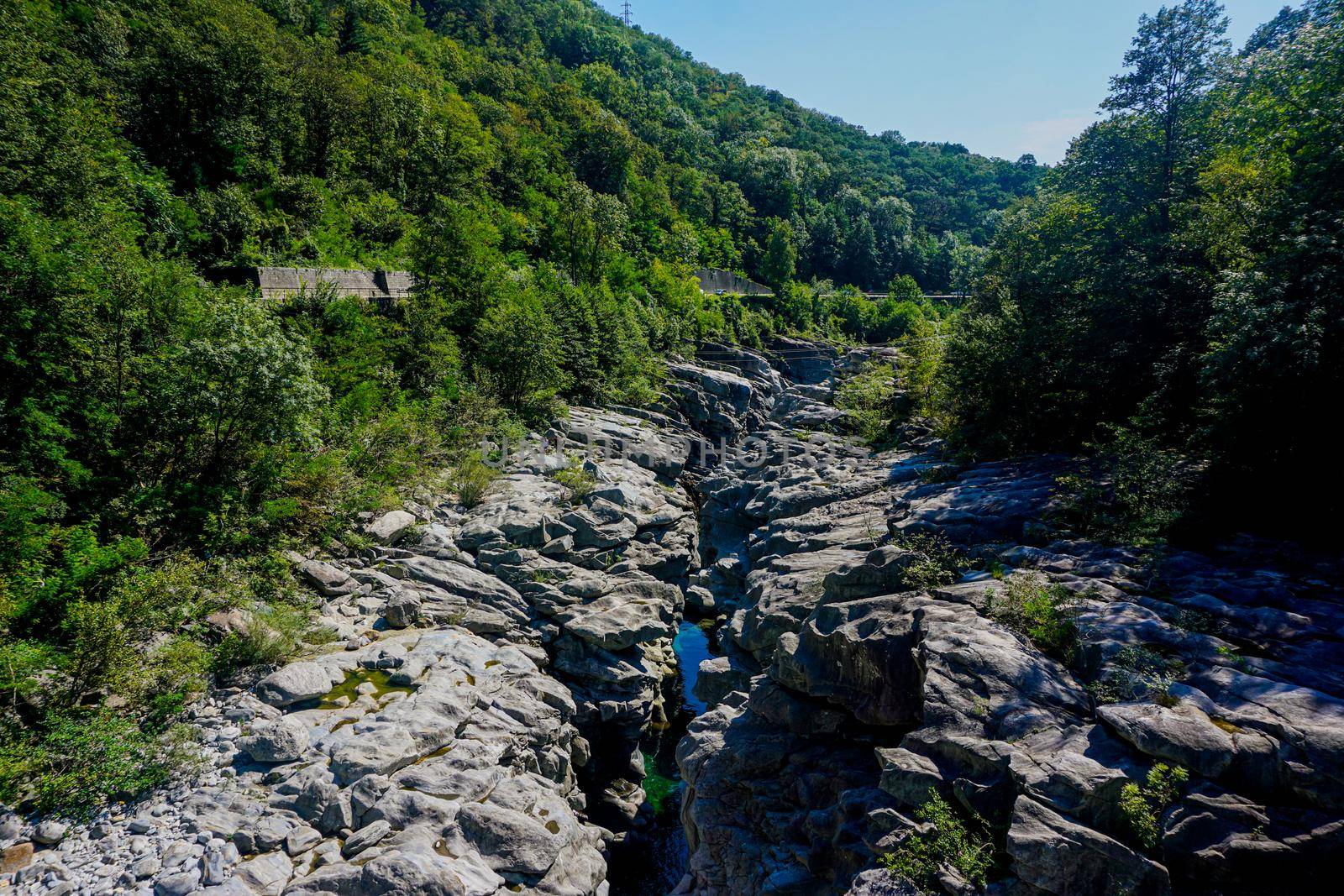 Canyon of the Maggia river with lots of puddles and huge rocks