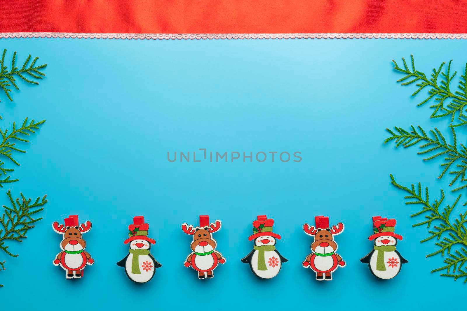 new year's card. toys and branches of thuja on a blue background. High quality photo