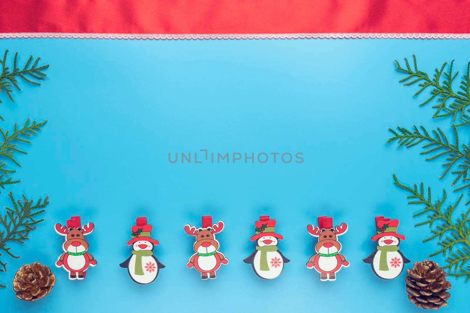new year's card. toys and branches of thuja on a blue background. High quality photo