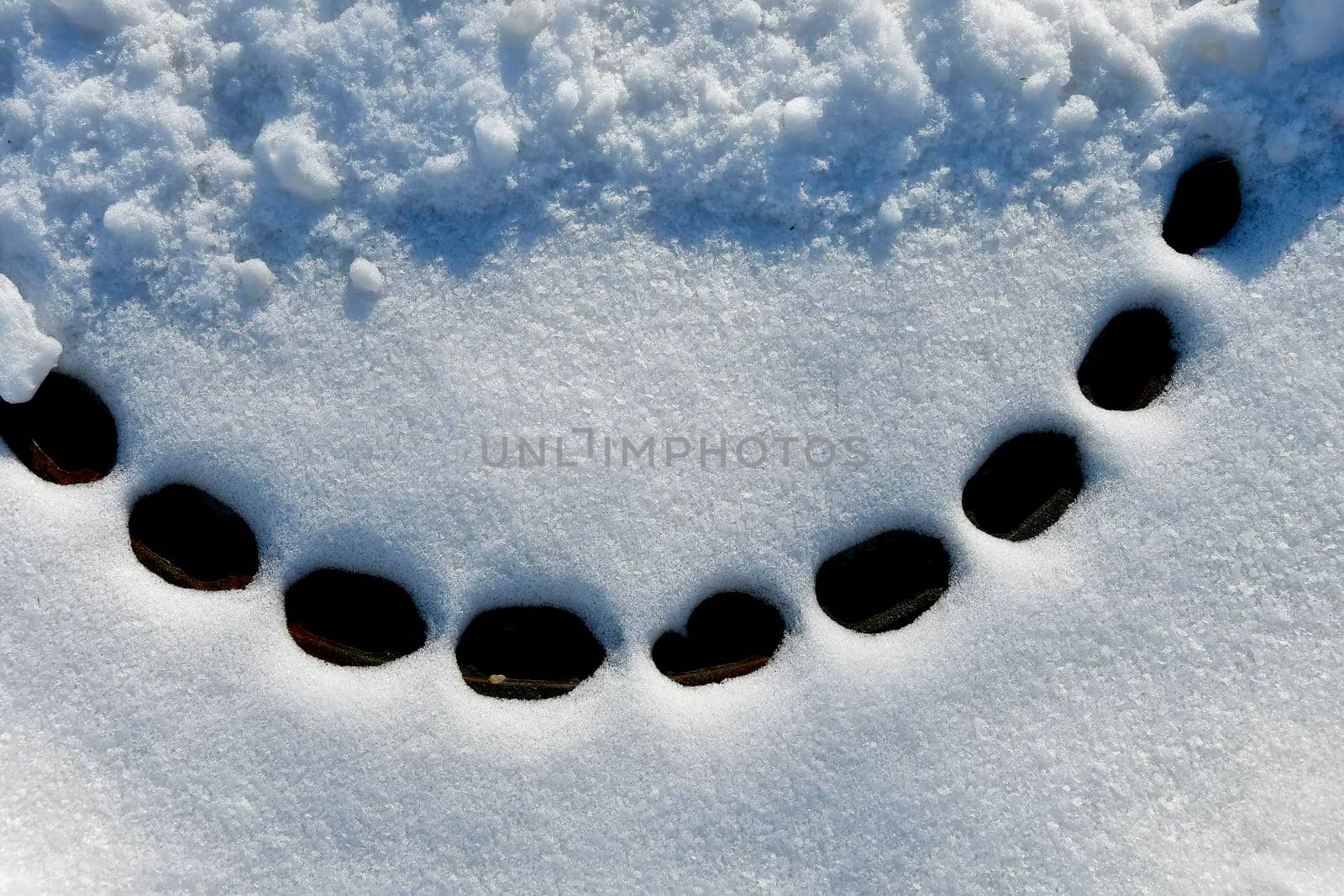 snow cover on a manhole cover