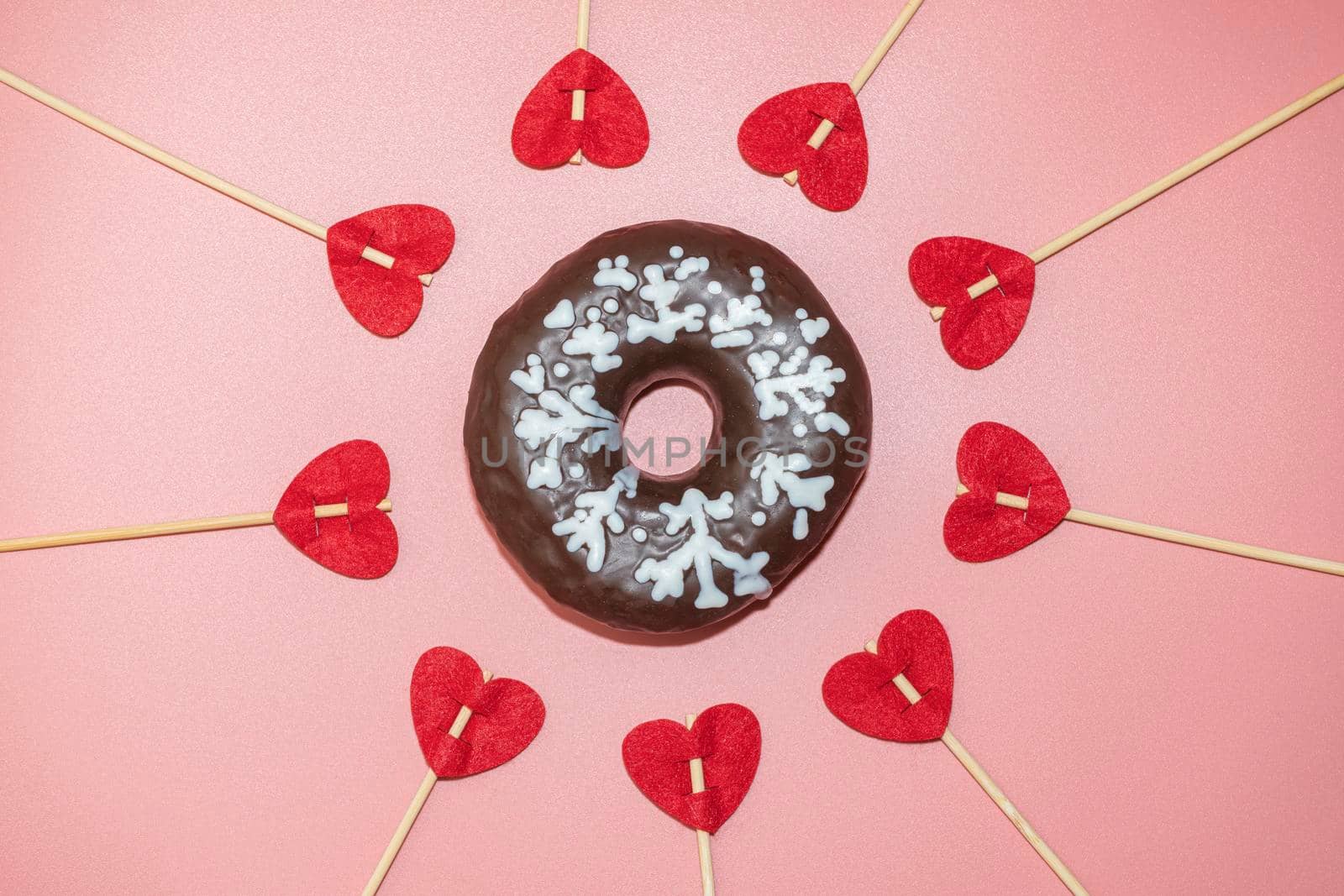 donut donuts on a pink background with hearts close-up. isolate. High quality photo