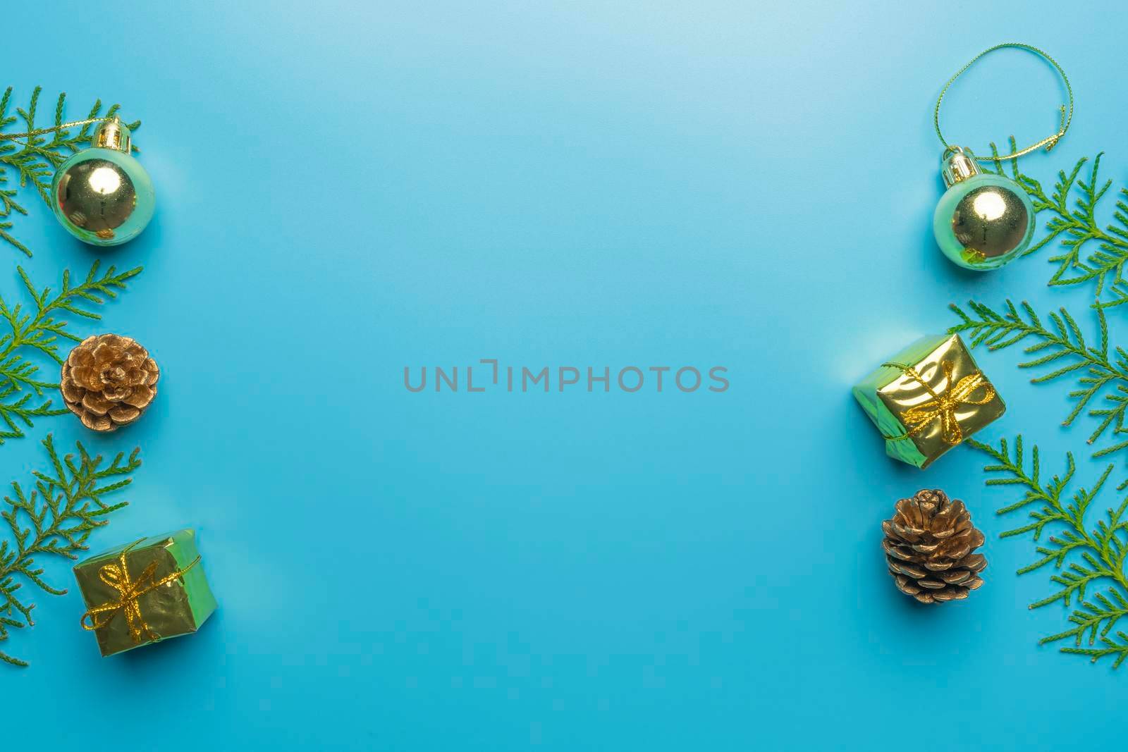 new year's card. toys and branches of thuja on a blue background. High quality photo