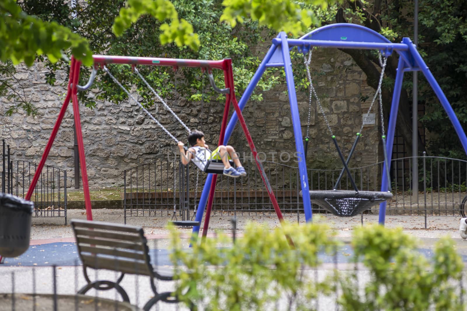 terni,italy august 16 2020:child at the park on swing