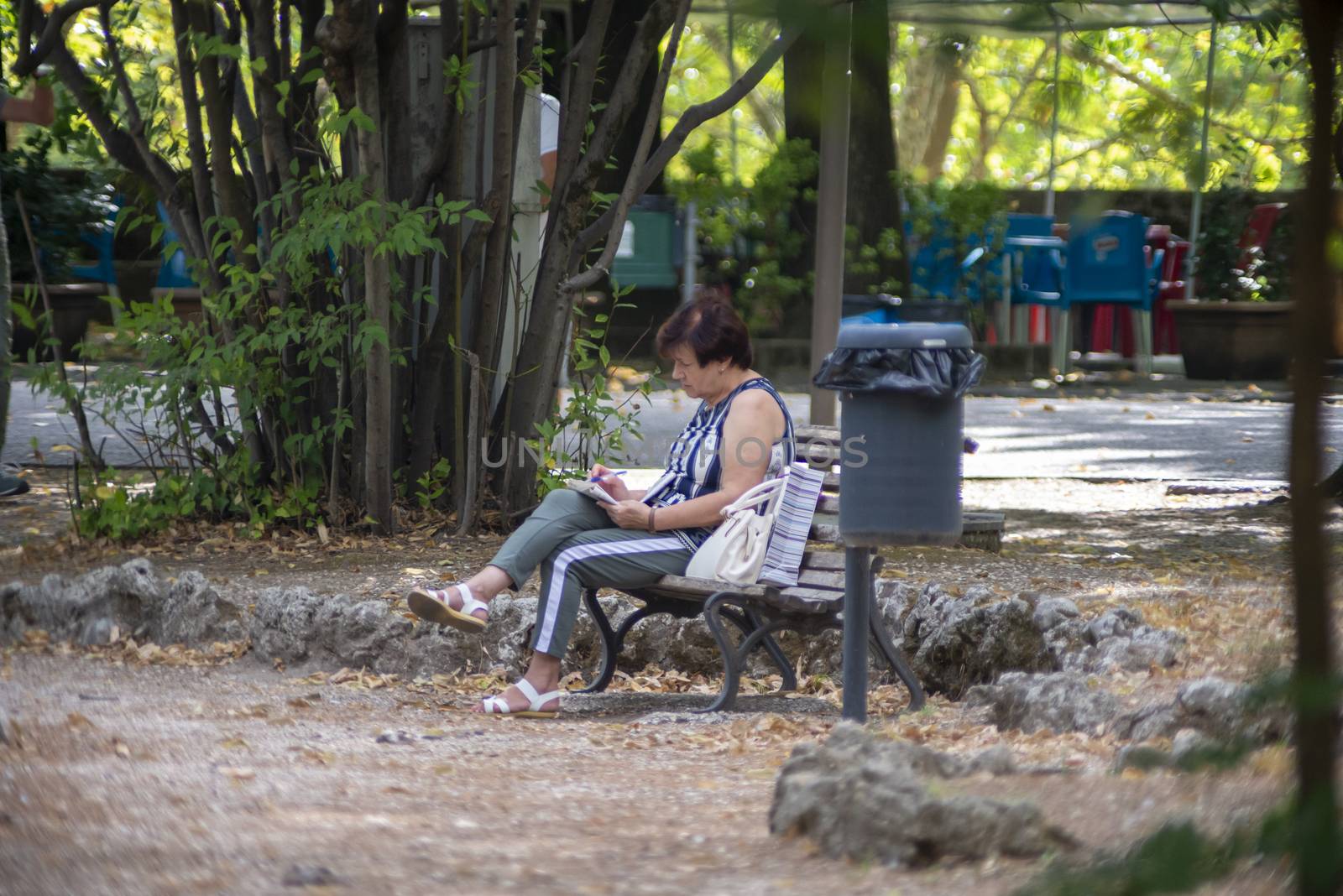 terni,italy august 16 2020:woman in the park alone cause covid 19