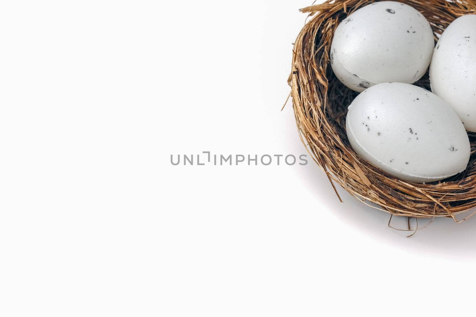 quail eggs in a nest on a white background. High quality photo
