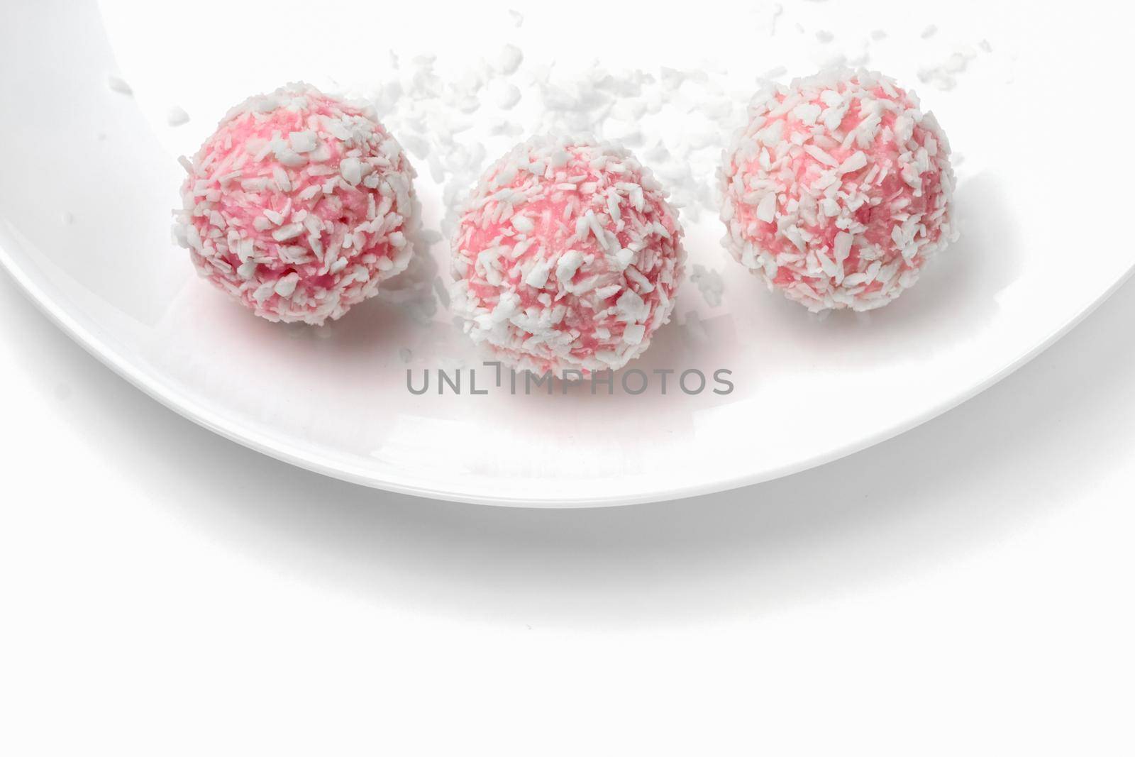 pink chocolate candy on a white background. candy ball macro. isolate. High quality photo