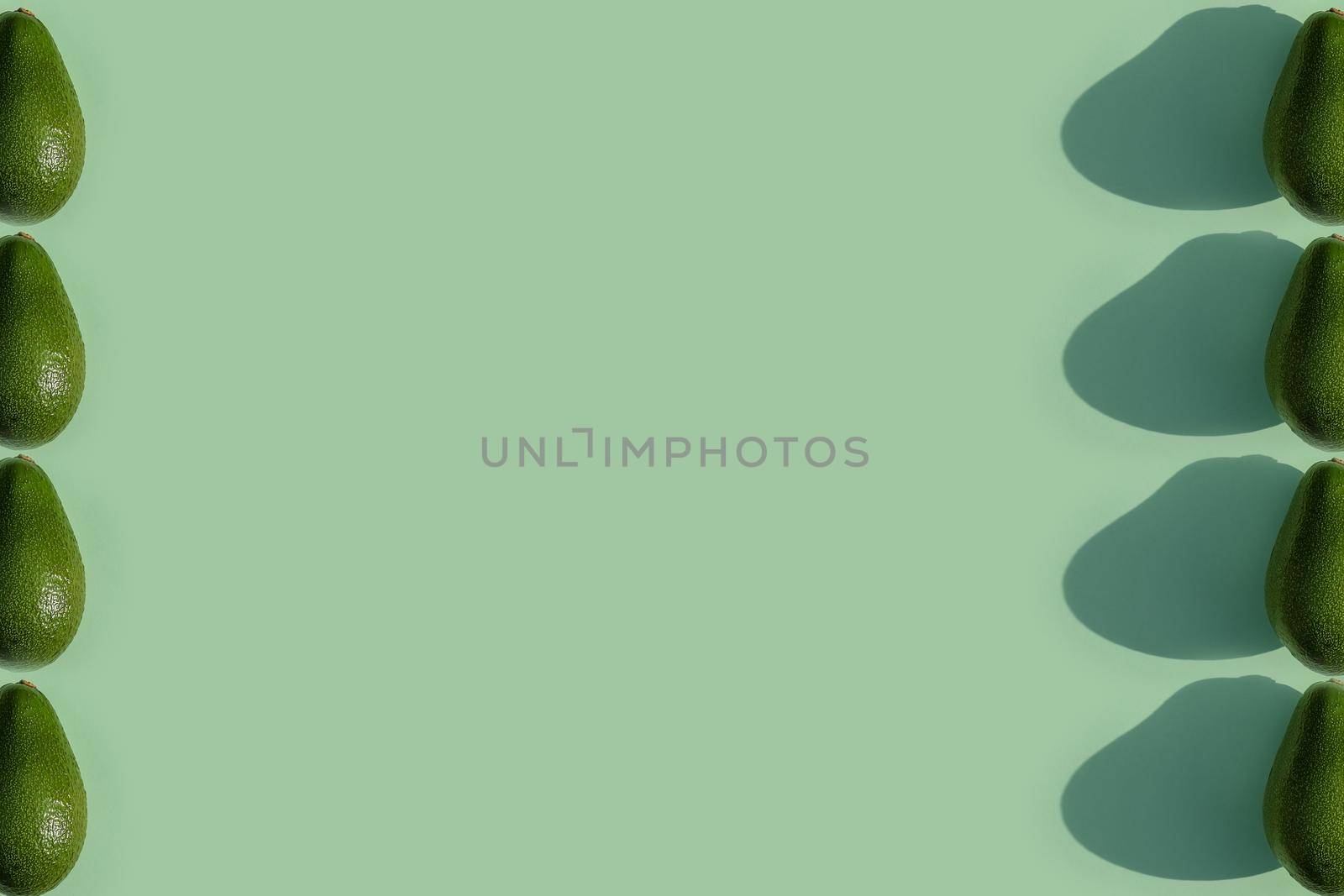 avocado color on a solid background, the top view pattern. High quality photo