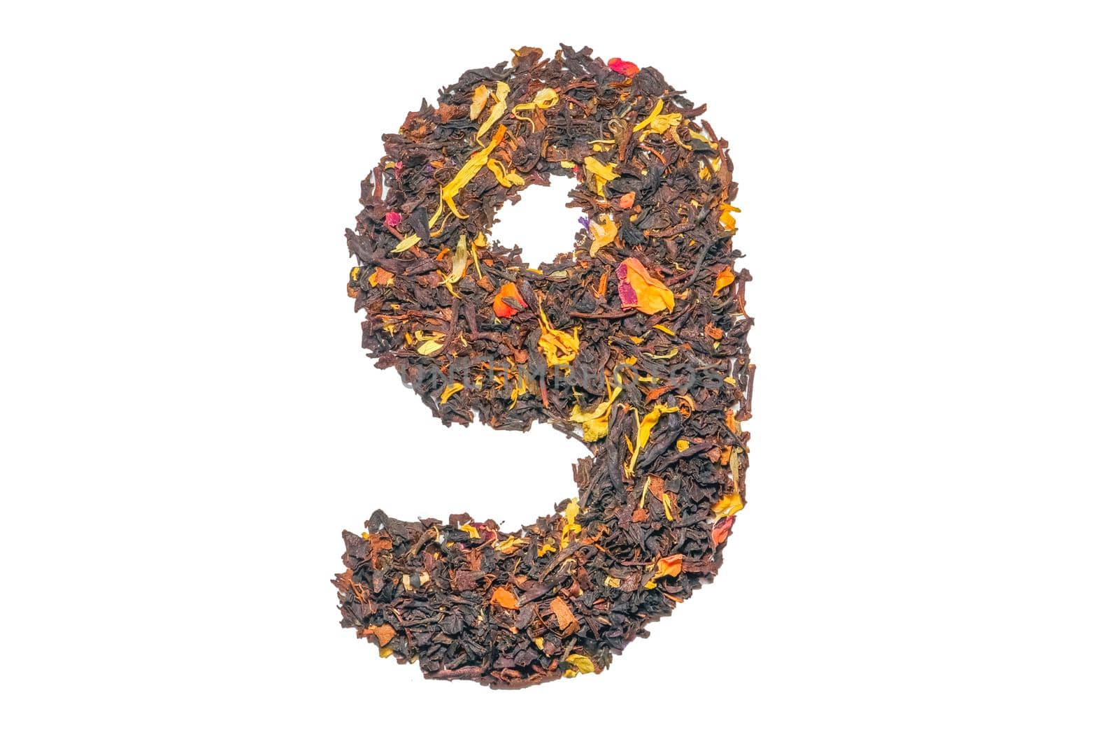 figure nine of black tea with flower petals and pieces of fruit isolate. High quality photo