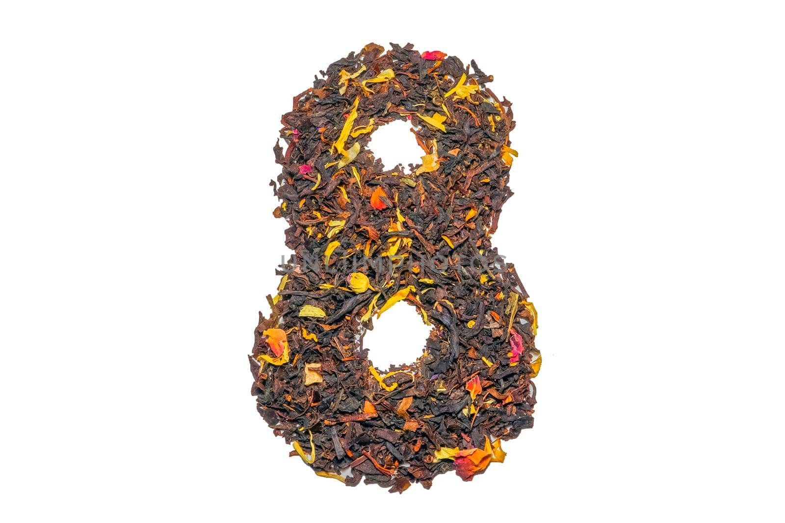 figure eight of black tea with flower petals and pieces of fruit isolate. High quality photo