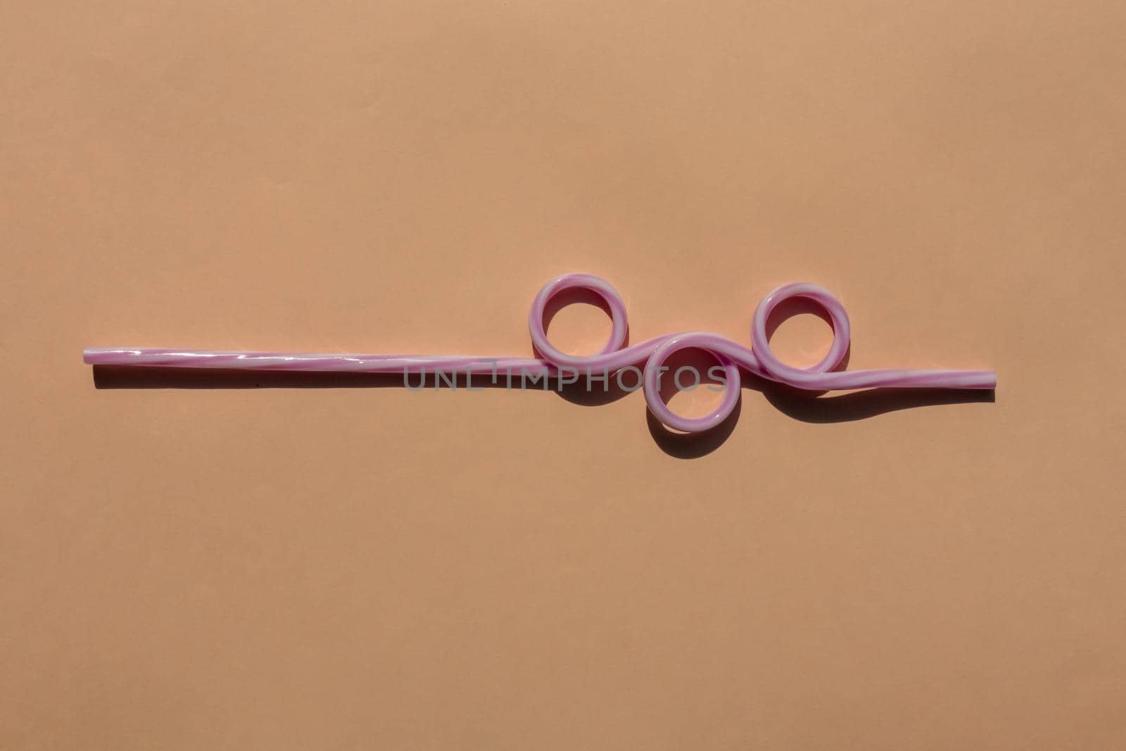 tubes for drinks on a brown background macro. place for the label. High quality photo