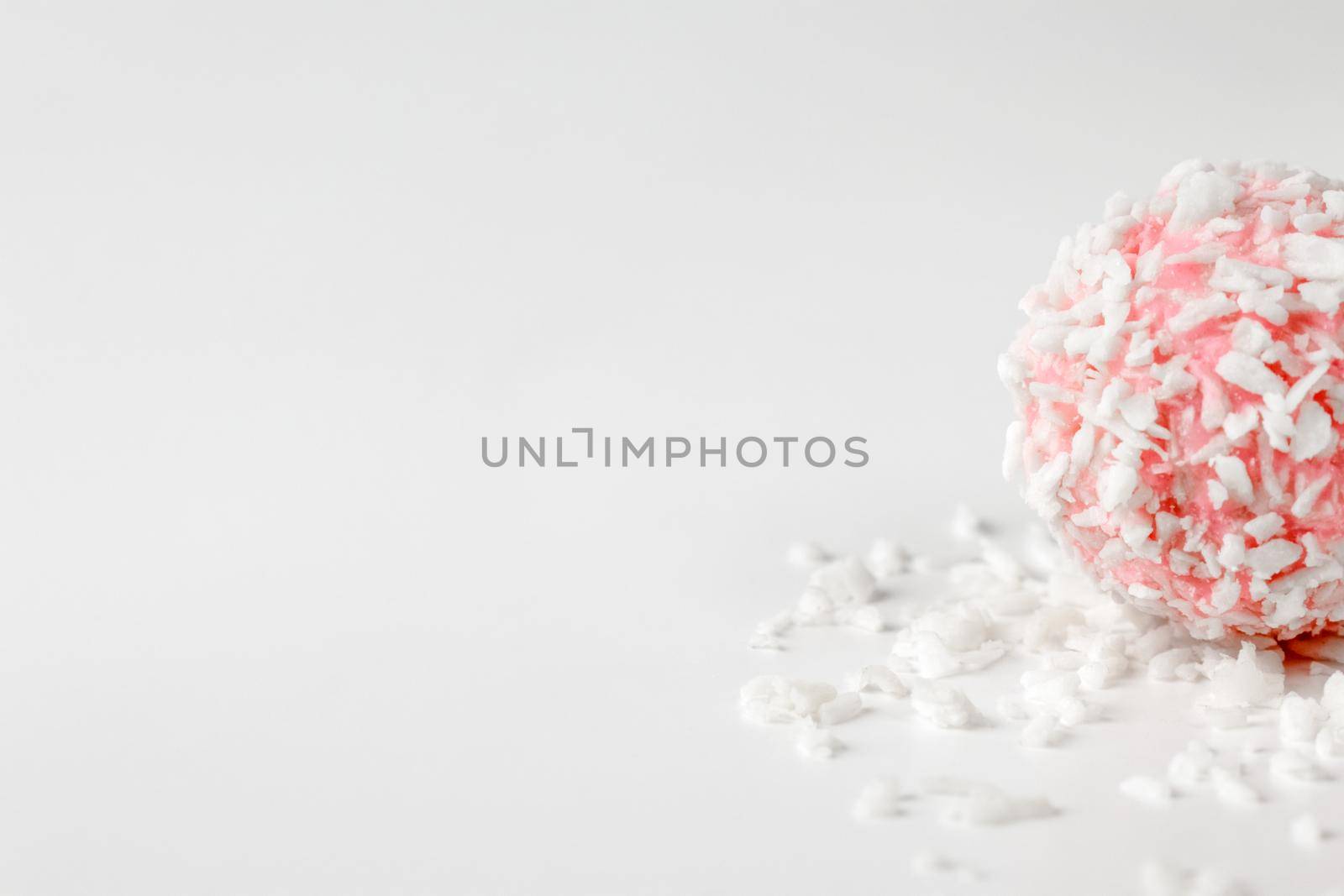 pink chocolate candy on a white background. candy ball macro. isolate. High quality photo