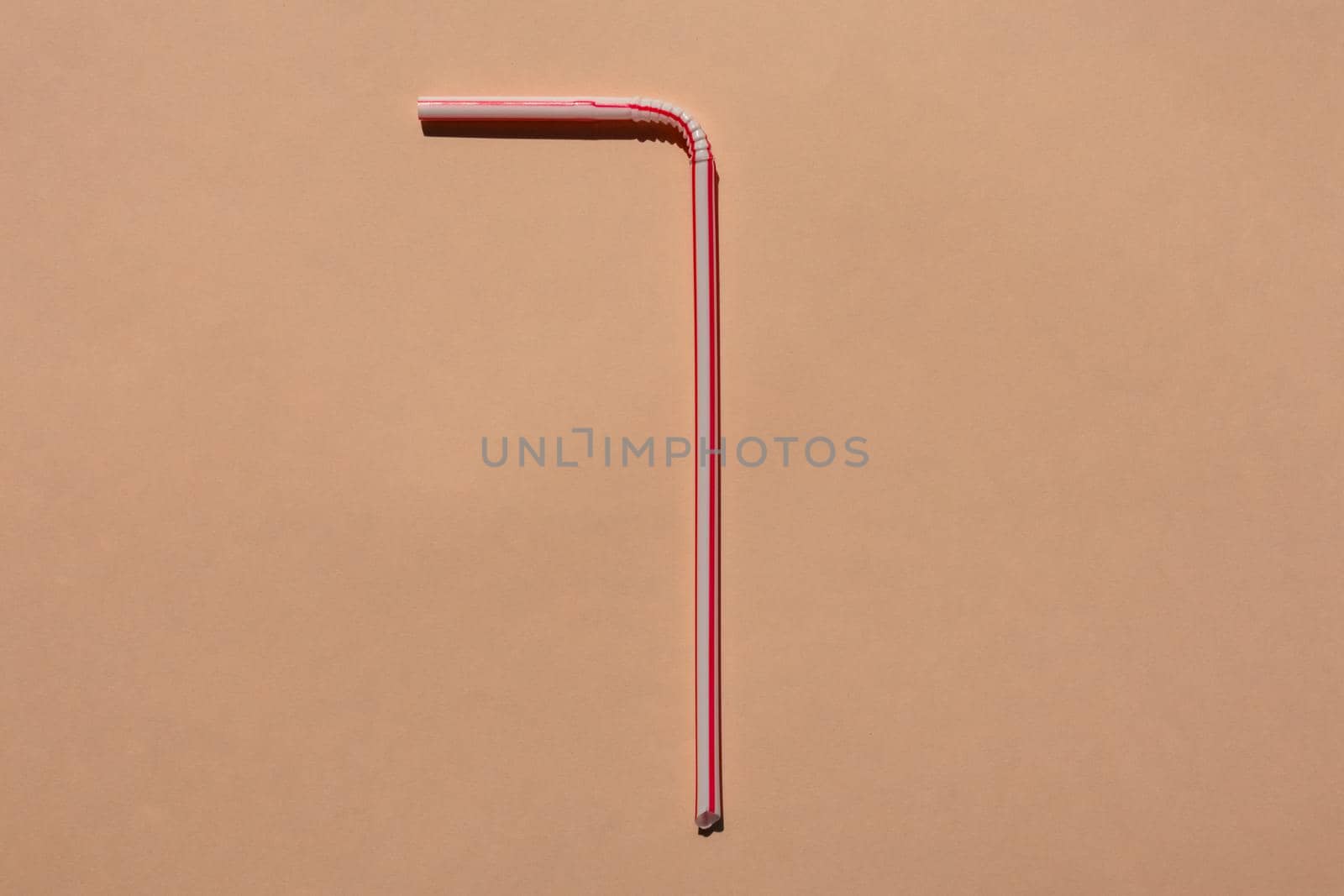 tubes for drinks on a brown background macro. place for the label. High quality photo