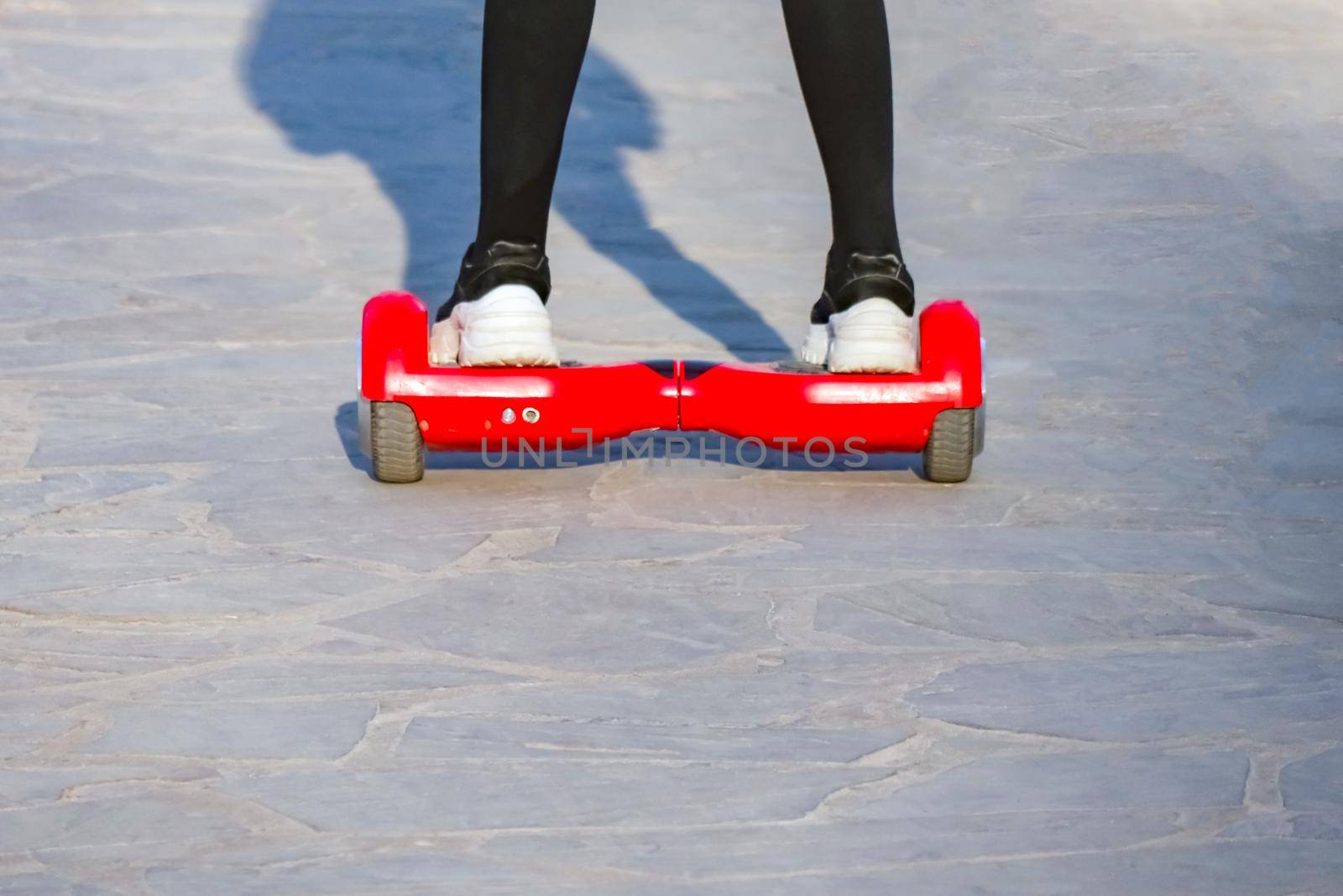 Teens riding gyrometer and skateboard closeup. High quality photo