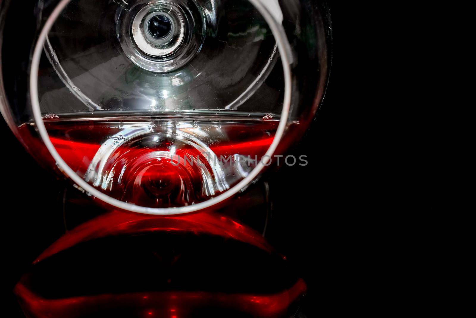glass of wine on a green background isolate