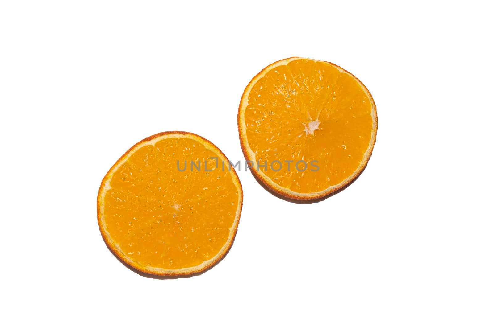 two orange slices on a white background. High quality photo