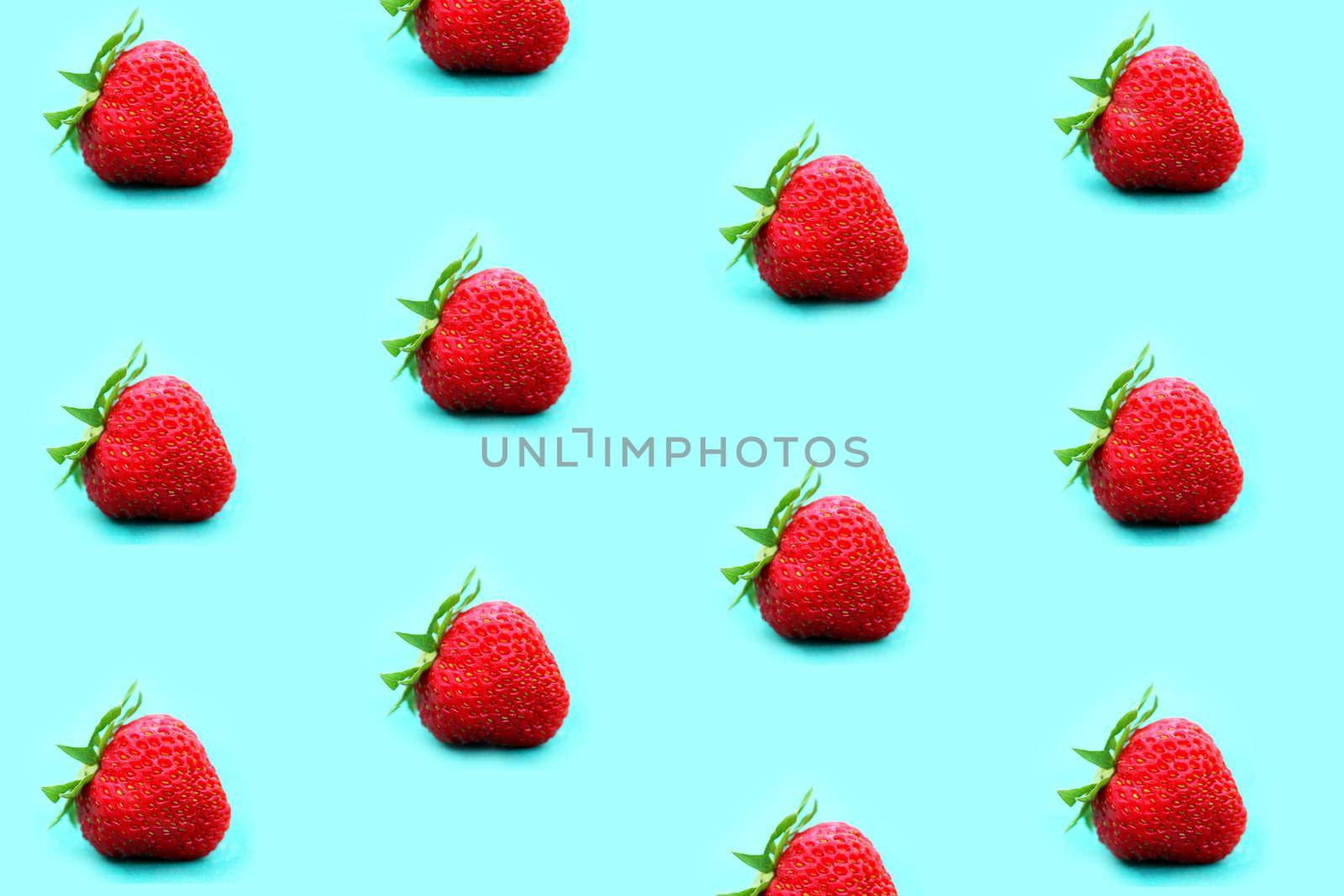 colorful strawberry pattern on a colorful background top view. High quality photo