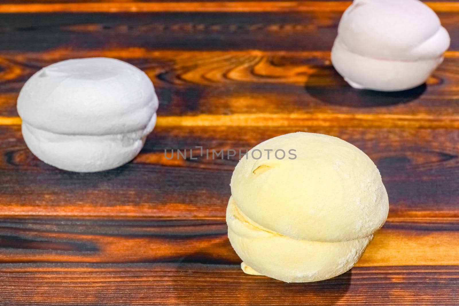 multicolored marshmallow on a wooden background macro. High quality photo