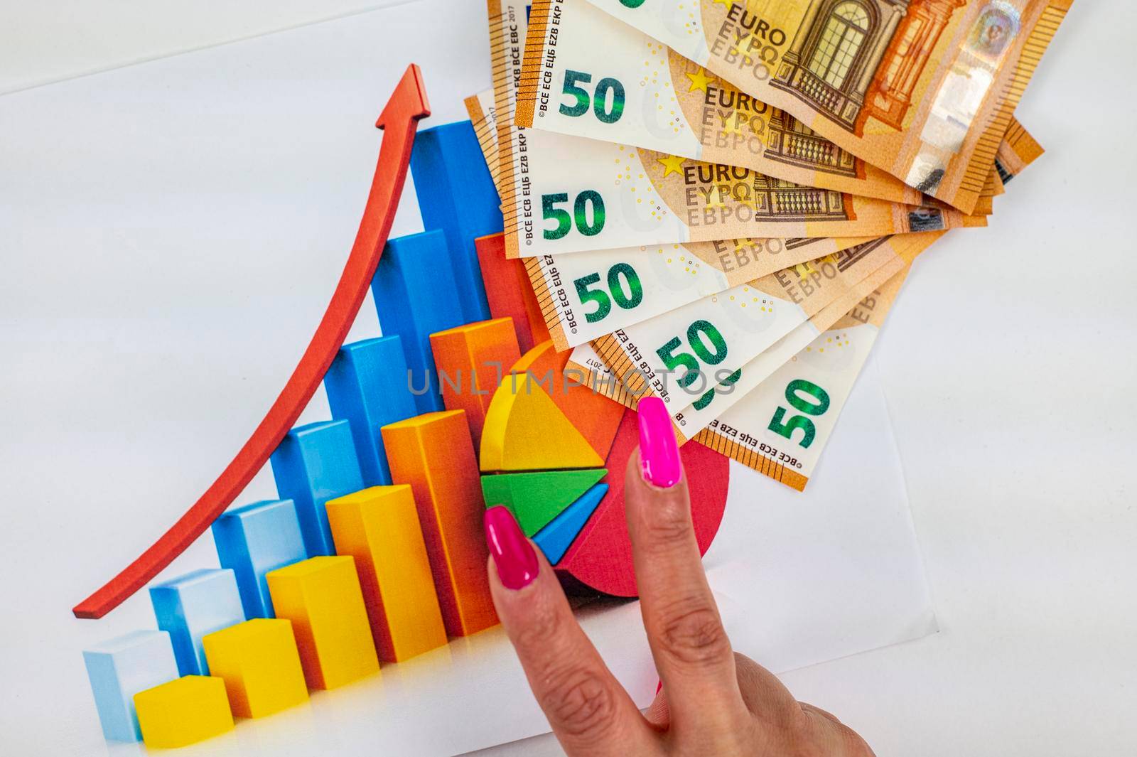 statistics chart with 50 bills and woman hand making victory symbol over white background