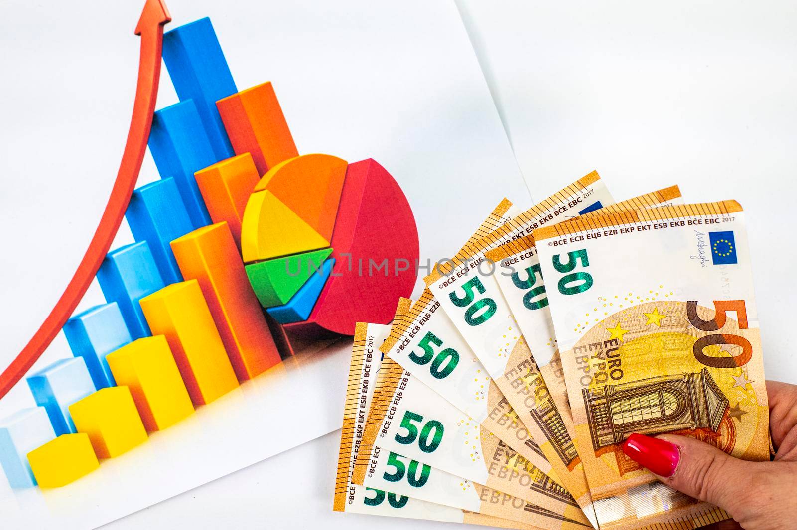 statistics graph with 50 euro banknotes on white background