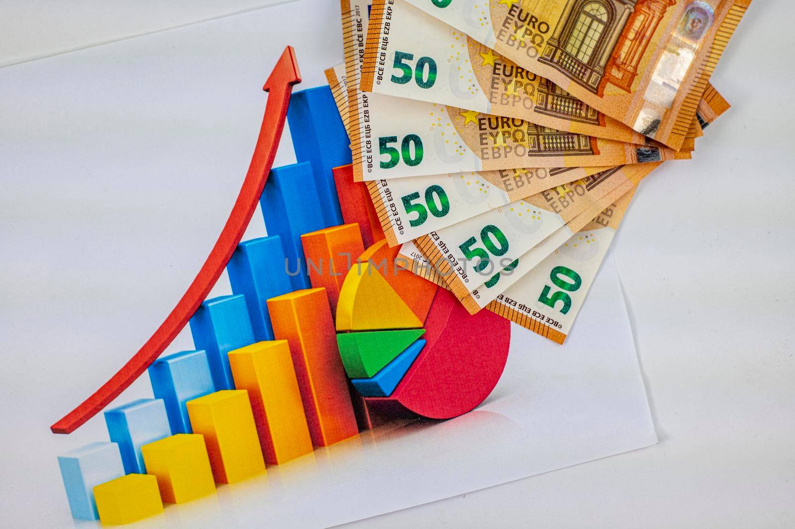 statistics graph with 50 euro banknotes on white background