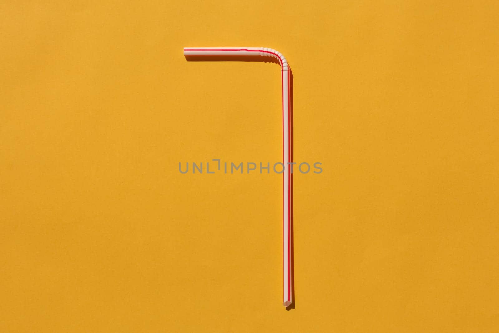 tubes for drinks on a yellow background macro. place for the label. High quality photo