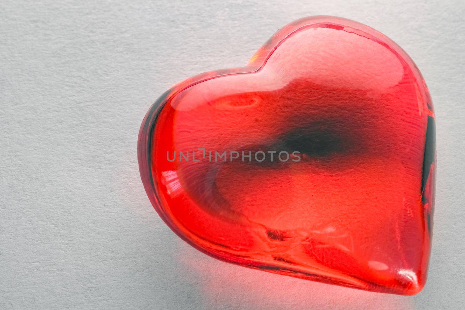 glass heart on a white background isolate macro