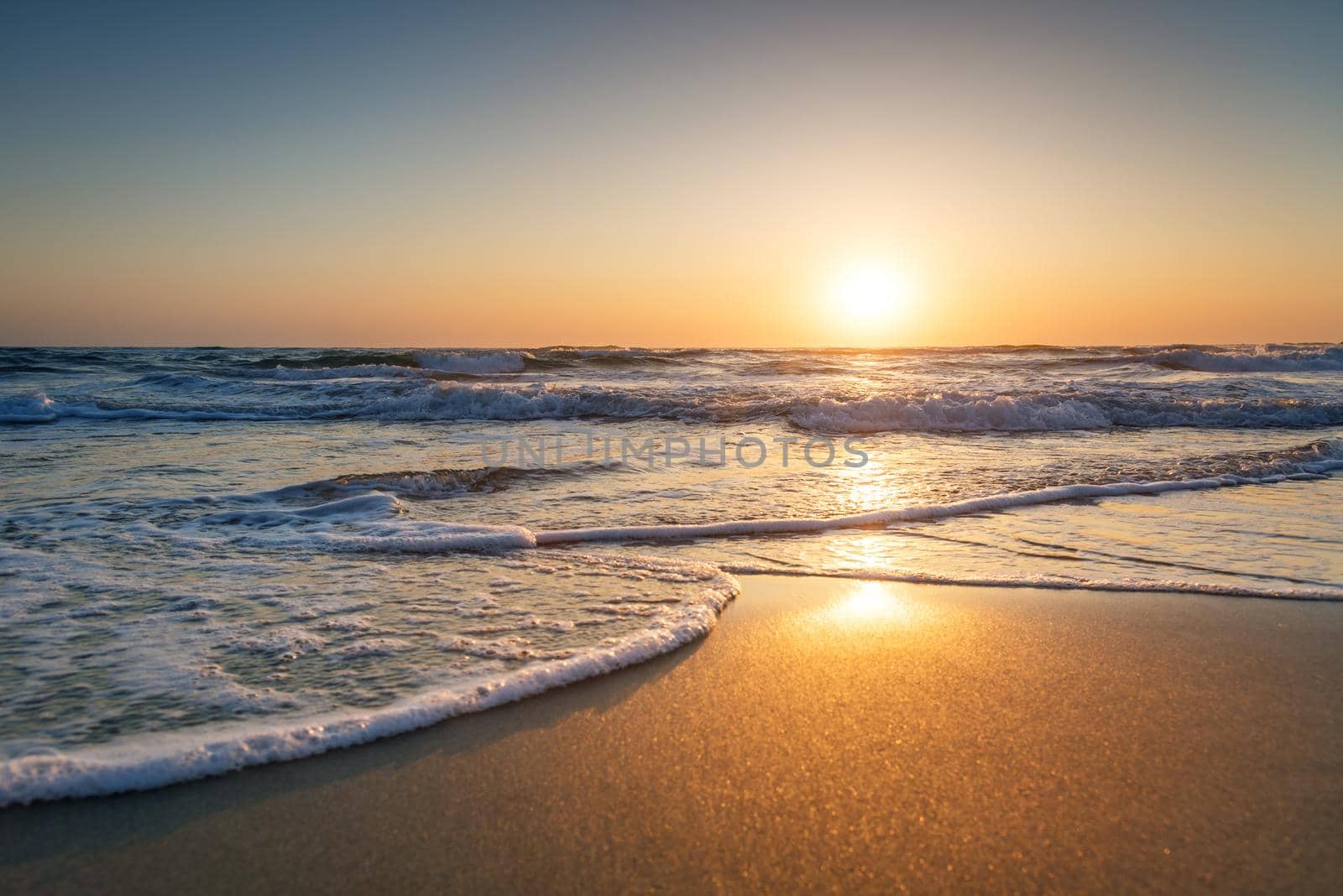 Early morning , sunrise over sea. Golden sands.