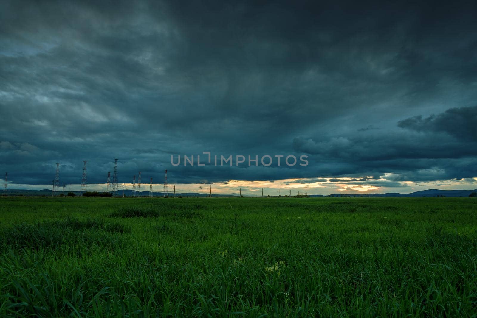 Dramatic sunset over a field in summer
