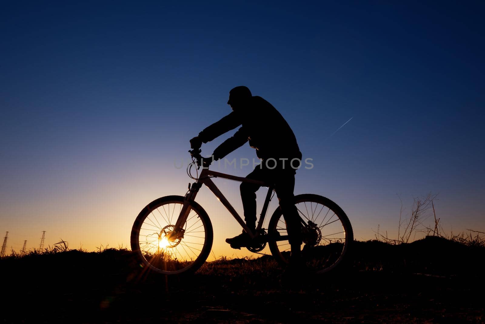 Dreamy sunset and healthy life.Fields and bicycle in summer 