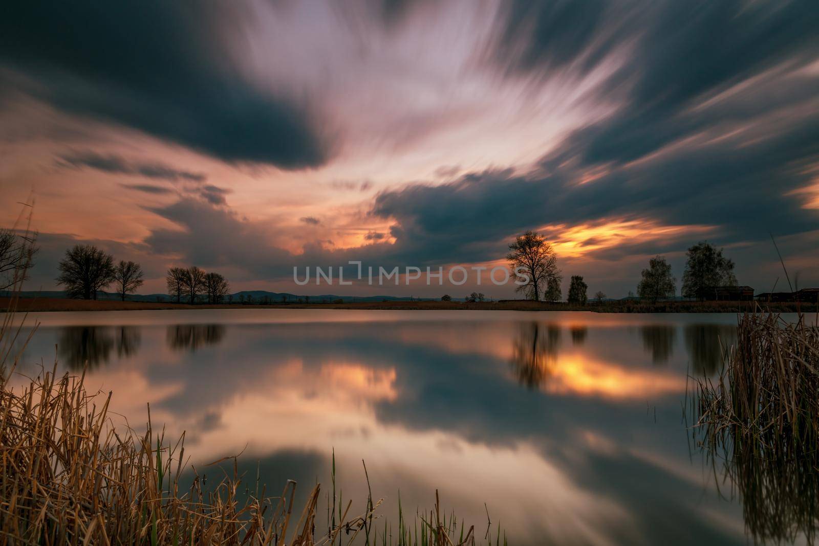 Magnificent long exposure lake sunset in summer 