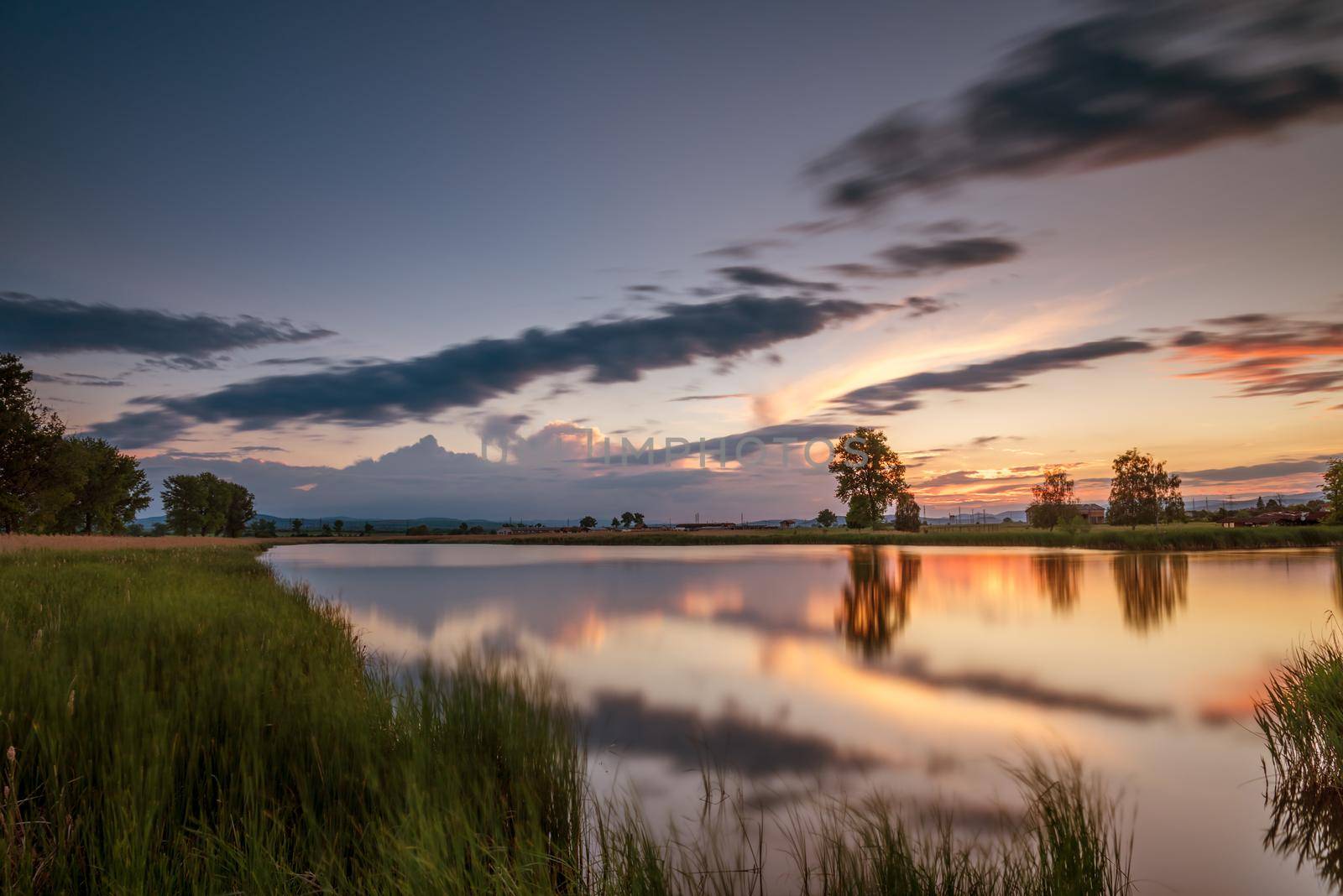 Magnificent long exposure lake sunset in summer