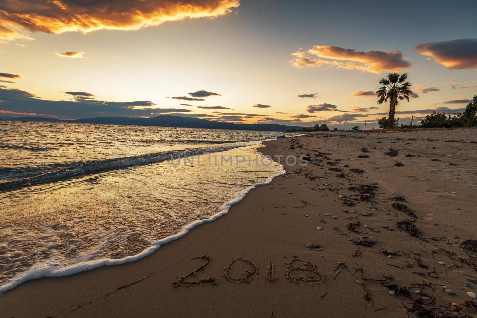 2018 written on sandy beach.Tropical beach.