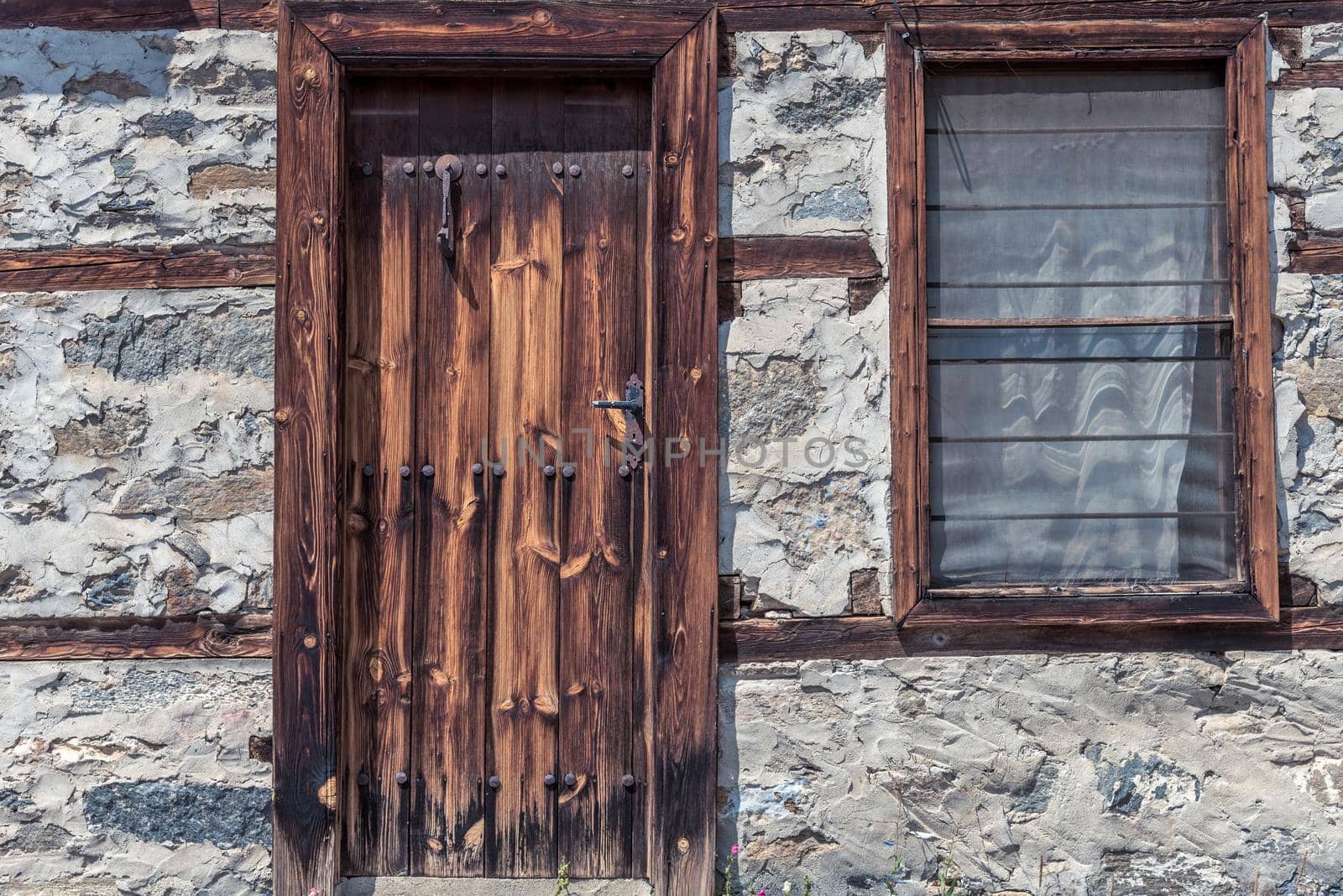 Old wooden door and a window 