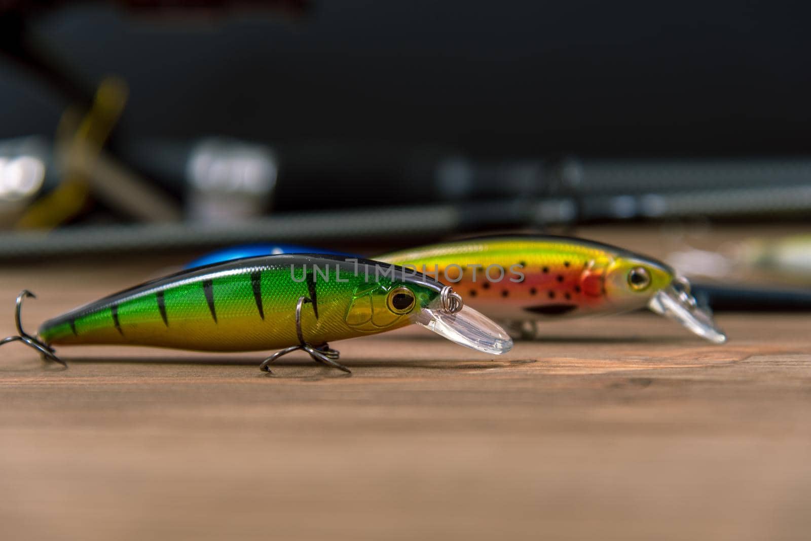 Fishing lures on a wooden background