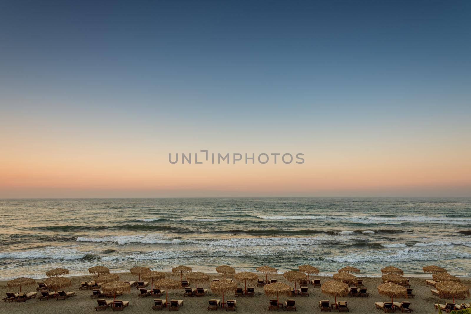 Tropical beach with colorful umbrellas