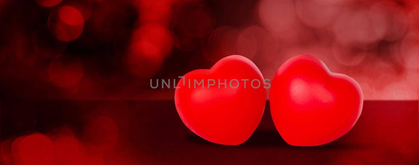 Two Heart shape on red bokeh background, abstract with glitter glowing, February 14 Valentine day, symbol of love and anniversary with romantic, couple sign with romance, nobody, holiday concept. by nnudoo