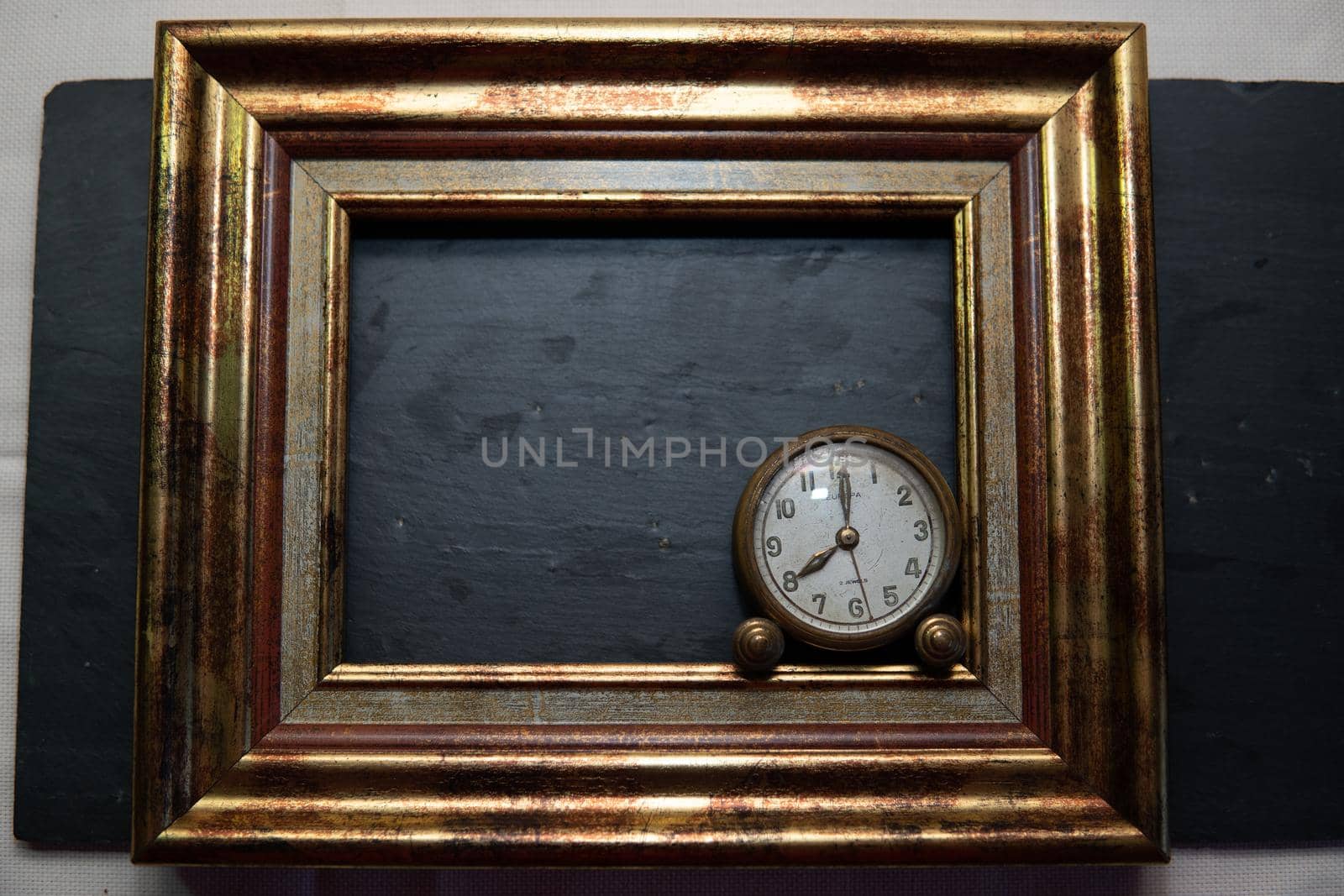 Vintage clock on black slate background and in marking by xavier_photo