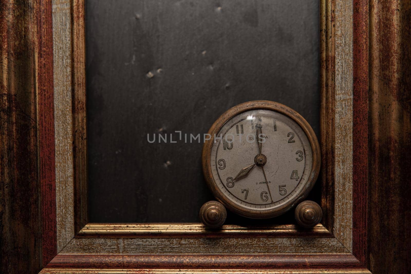 Vintage clock on black slate background and in marking by xavier_photo