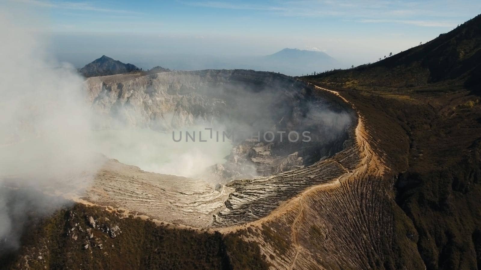 Crater with acidic crater lake, Kawah Ijen the famous tourist attraction, where sulfur is mined. Aerial view of Ijen volcano complex is a group of stratovolcanoes in the Banyuwangi Regency of East Java, Indonesia.
