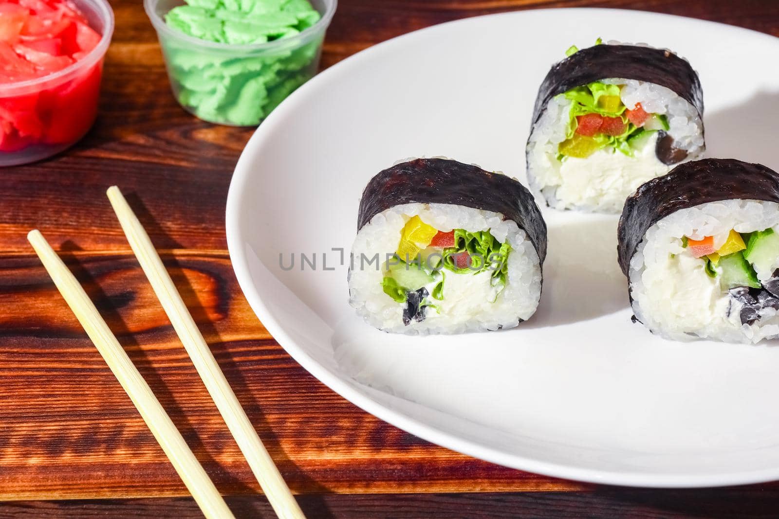 sushi on a wooden background close up by roman112007