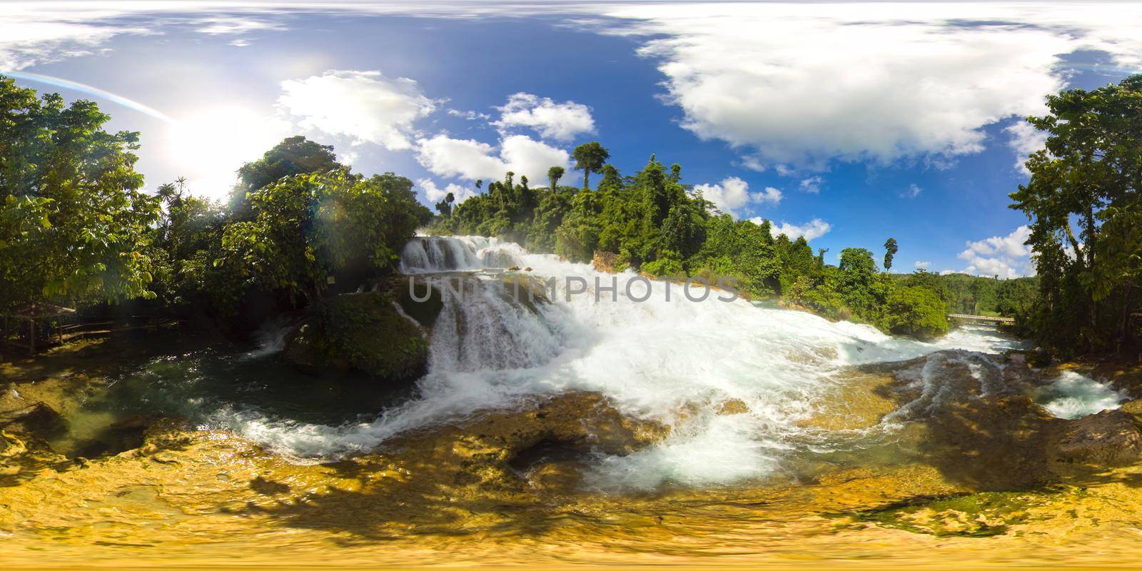 Cascade of Aliwagwag Falls in green forest, aerial drone. Waterfall in the tropical mountain jungle. Philippines, Mindanao. 360 panorama VR.