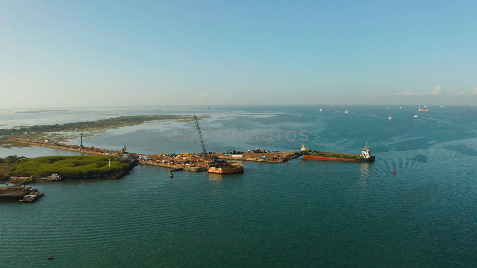 Seaport with cranes and harbor with cargo ships, Cebu City, Philippines. Ships in industrial port.