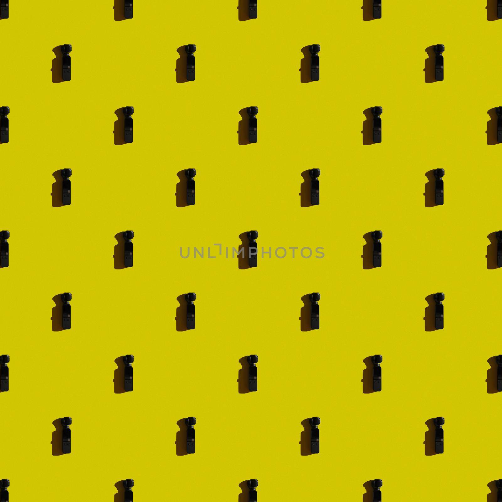 Template. Vertical modern mini camcorder on yellow background.Top view, flat lay, layout.