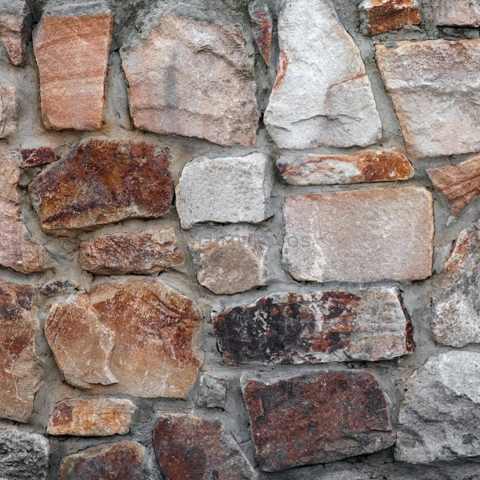 masonry wall paving stones as a background close up by roman112007