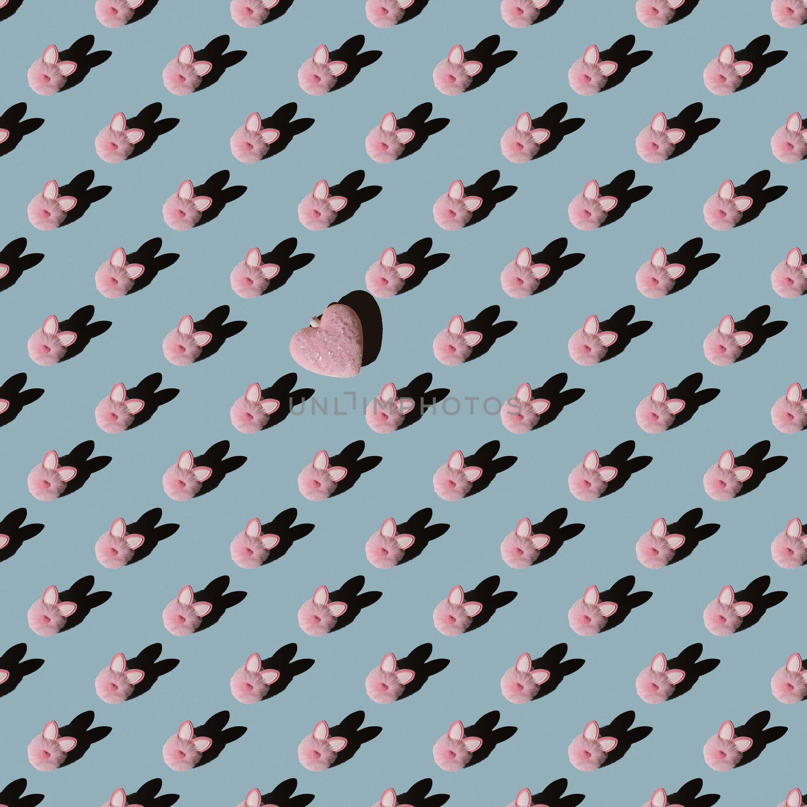 Easter pattern, pink bunny on a blue background. Flat composition with decorative hearts.
