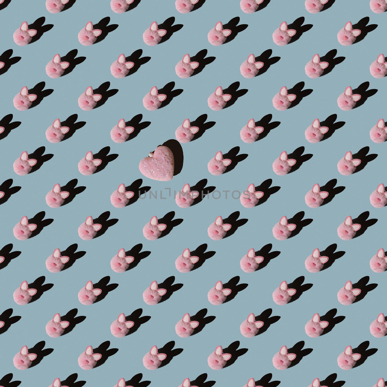 Easter pattern, pink bunny on a blue background. Flat composition with decorative hearts.