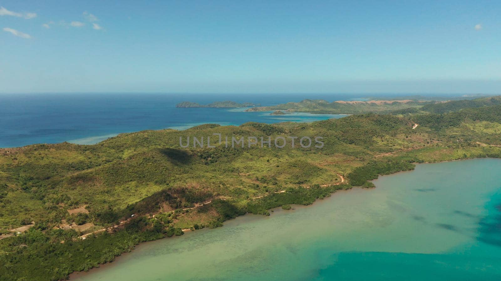 aerial view small island group in province of Palawan. Busuanga, Philippines. Seascape, islands covered with forest, sea with blue water. tropical landscape, travel concept