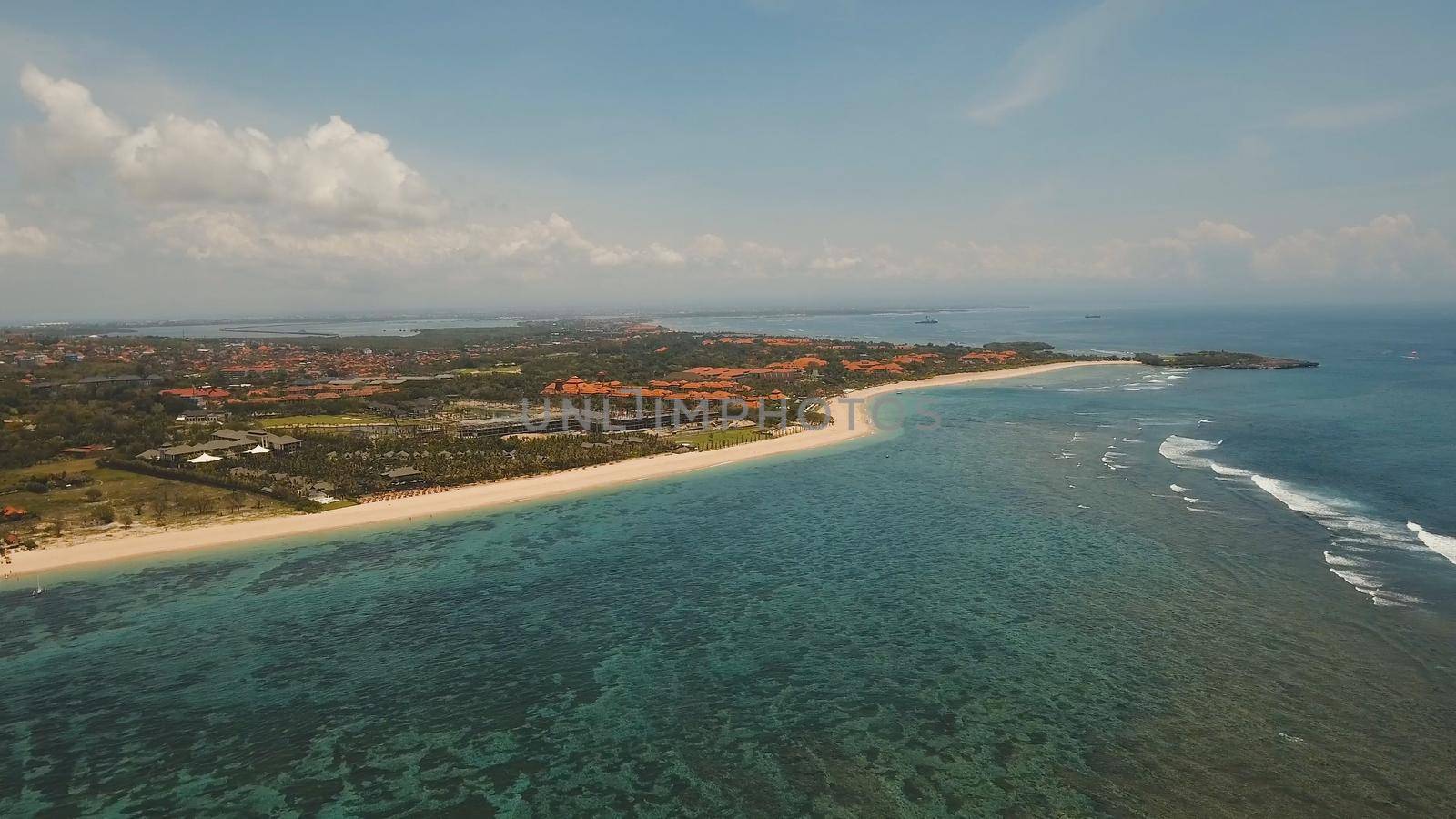 Aerial view of beautiful beach, hotels and tourists, Pura geger, Nusa Dua, Bali, Indonesia. Seascape, beach, ocean sea Travel concept